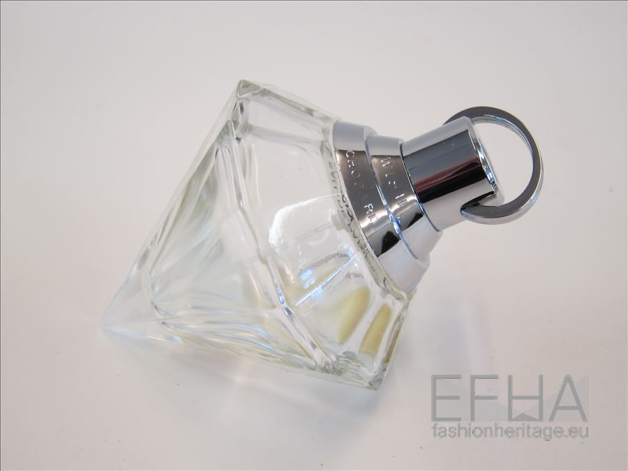 Diamantvormige parfumfles in transparant glas en metalen sprayknop